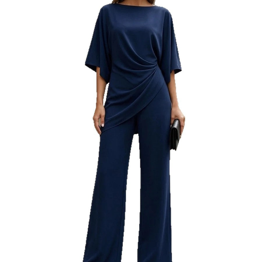 Front view of the navy blue drop-waist shirt and wide-leg pants set on a white background